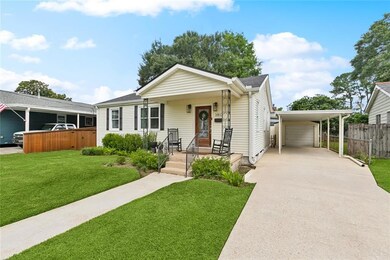 Large driveway with carport