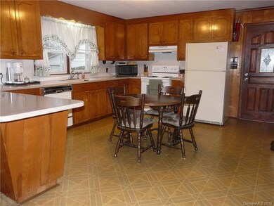 Kitchen.  Door leads to large sunroom.