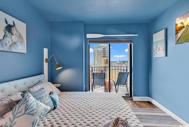 Bedroom with hardwood / wood-style flooring and ac