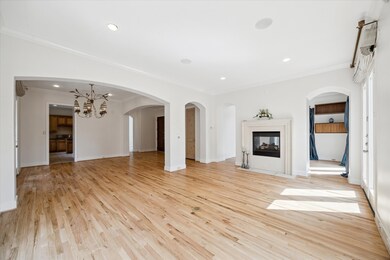 Grand archways separate the living spaces, adding