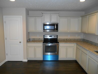 kitchen with ample counter space and cabinets. pantry 