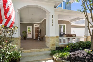 The front exterior features 2022 roof replacement, fresh paint via 2022 with a double-wide driveway and inviting front porch that leads you into the entry way.