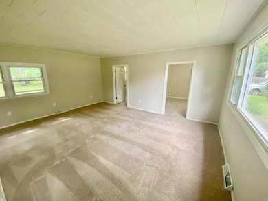 Living room looking from the front door at the 2 bedrooms.