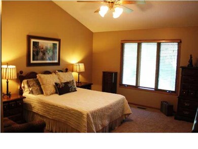 Spacious master bedroom with vaulted ceiling.