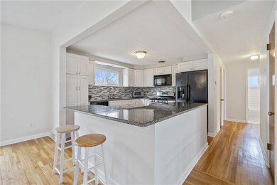 This photo shows the open kitchen w/a massive sit-