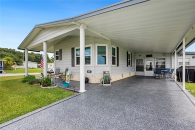 Painted driveway on this oversized carport home.