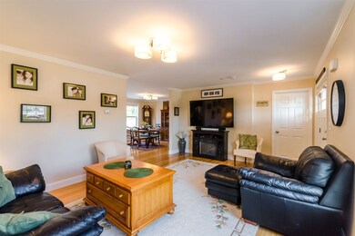 Crown molding throughout living, dining, kitchen.