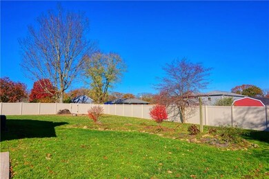 Large rear yard with a new vinyl privacy fence (su
