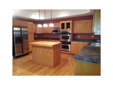 Kitchen. Custom built cabinets and breakfast bar