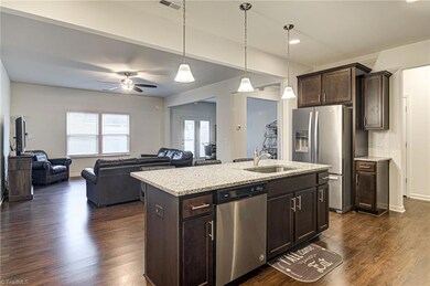 Large kitchen island provides extra meal prep space and a spot for enjoying morning coffee, casual meals, or spot for homework!