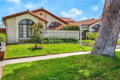 Well maintained raised planters in front yard.