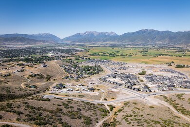 Aerial perspective of suburban area with a mountain backdrop