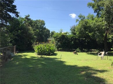 View of the nice fenced level back yard.