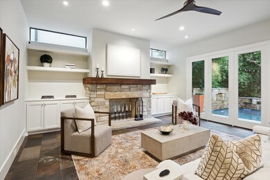 LIVING ROOM - Main living space with stone floors,