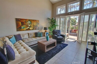 Living Area with Fireplace, Shutters and Access to Rear Yard