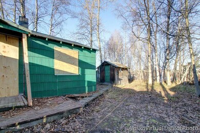 Small house and shed on property