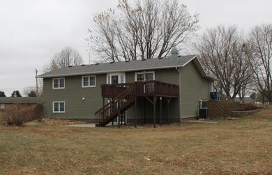 The back of the home features a large walk out dec