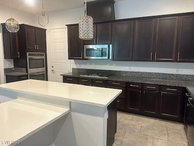 Kitchen with appliances with stainless steel finis