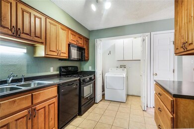 Laundry access off of Kitchen, Gas Range and Tile