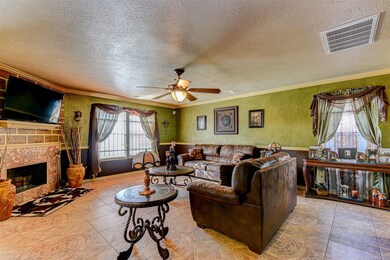 Another view of the living room and fireplace