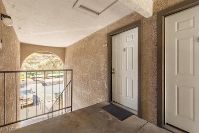 Entrance to property with a balcony