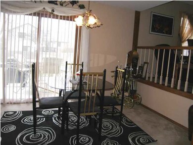 The dining is open to the living and offers a slid