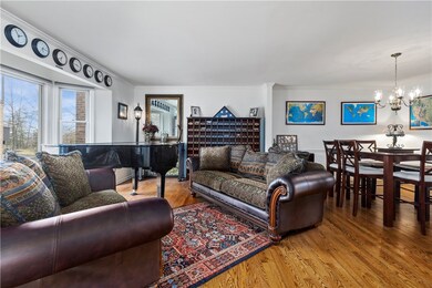 Bright and cheerful living room with bay window, c