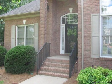 Black metal railing matches patio and rear fence y