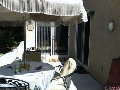 Backyard patio enjoyed from kitchen and guest bedr
