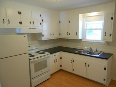 Kitchen, wood floors, door to rear...