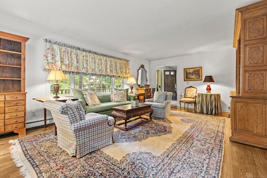 View of Living Room with Hardwood Floors, Facing Entrance Foyer