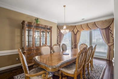 An elegant dining room offers plenty of space for