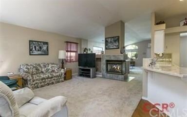 Family room with see through fireplace and open to