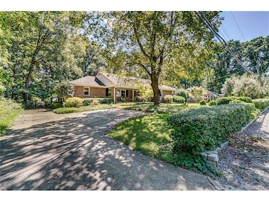 Paved driveway with fenced back yard and parking i