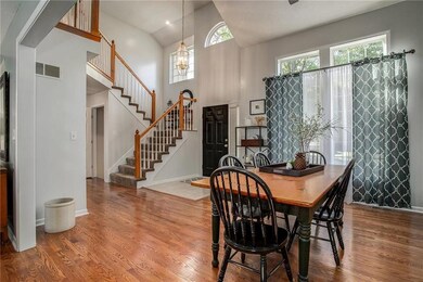 Enter into the soaring 2-story foyer and notice th