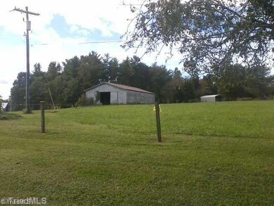 Exterior Front. 6 stall barn, 2 fenced pastures