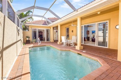 Outdoor pool with a patio area, a ceiling fan, and