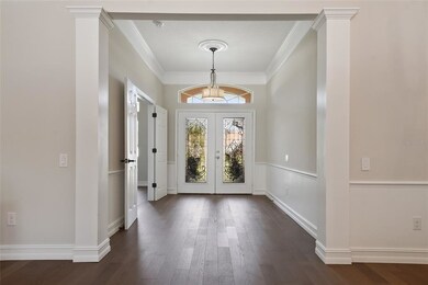 Grand open Foyer with Engineered Wood Flooring and