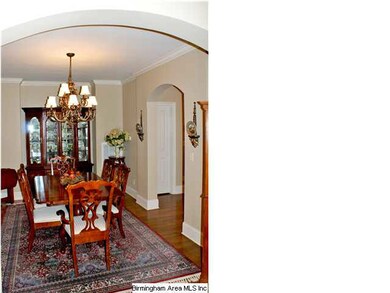 Formal Dining Room has hardwood floors, crown mold