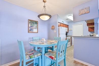 This dining area is open to both the kitchen and l