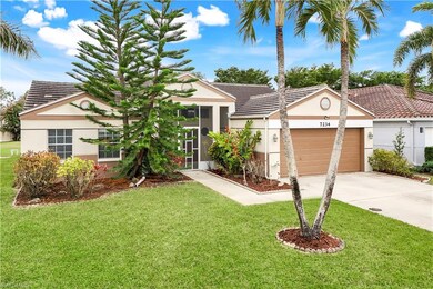 View of front of property featuring a garage and a