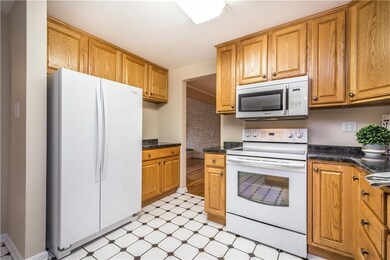 Kitchen features updated appliances which are incl