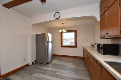 Kitchen with newer luxury vinyl flooring.