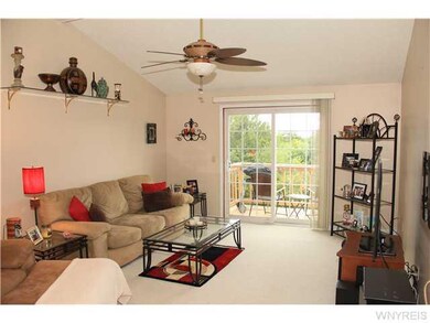 Living Room. CATHEDRAL CEILING GIVES A SPACIOUS FE