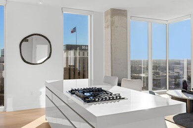 Kitchen with baseboards, floor to ceiling windows
