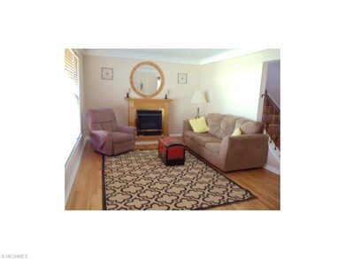 LIVING ROOM OFFERS A LARGE PICTURE WINDOW AND A GA