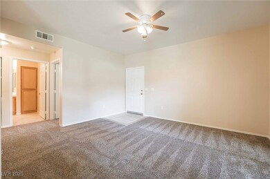 Living room opens up to the hallway leading to bed