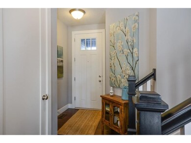 Lovely foyer with space for a furniture piece.