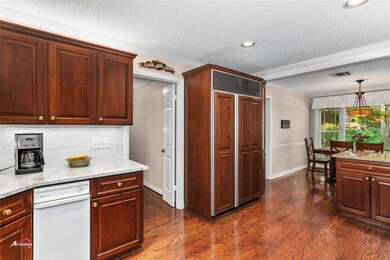 Kitchen with a textured ceiling, ornamental moldin