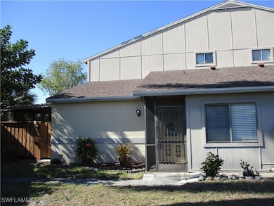 View of front facade featuring roof with shingles
